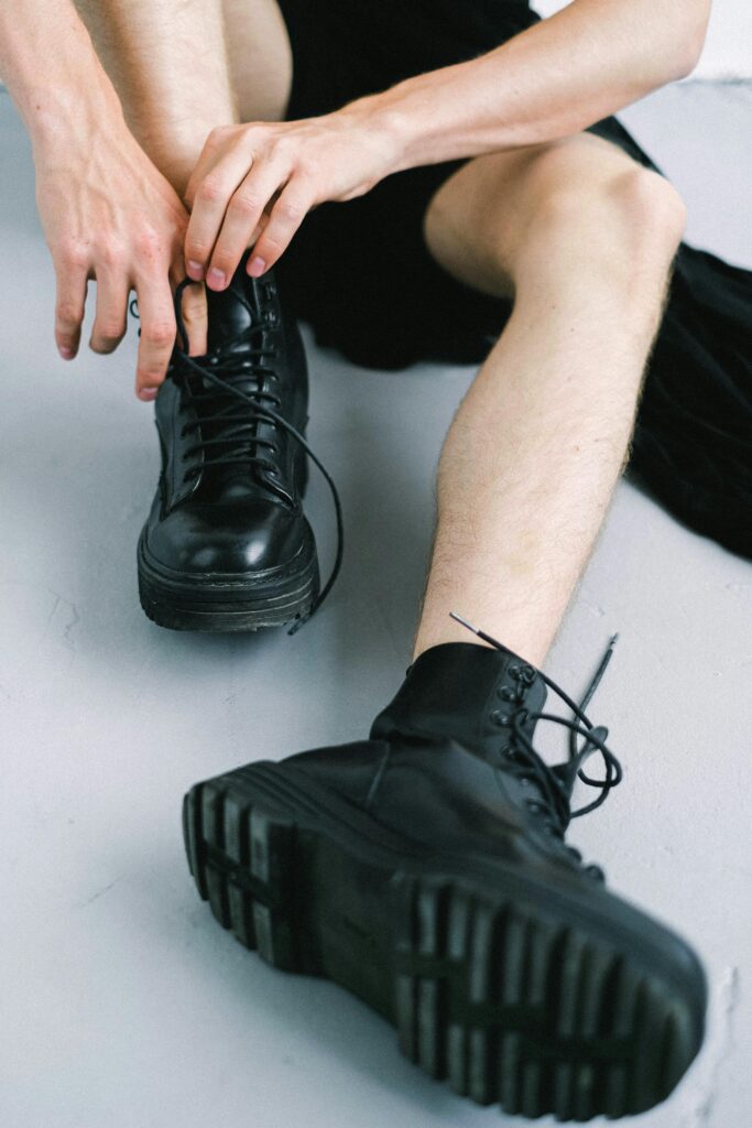 Man with large combat boots on.